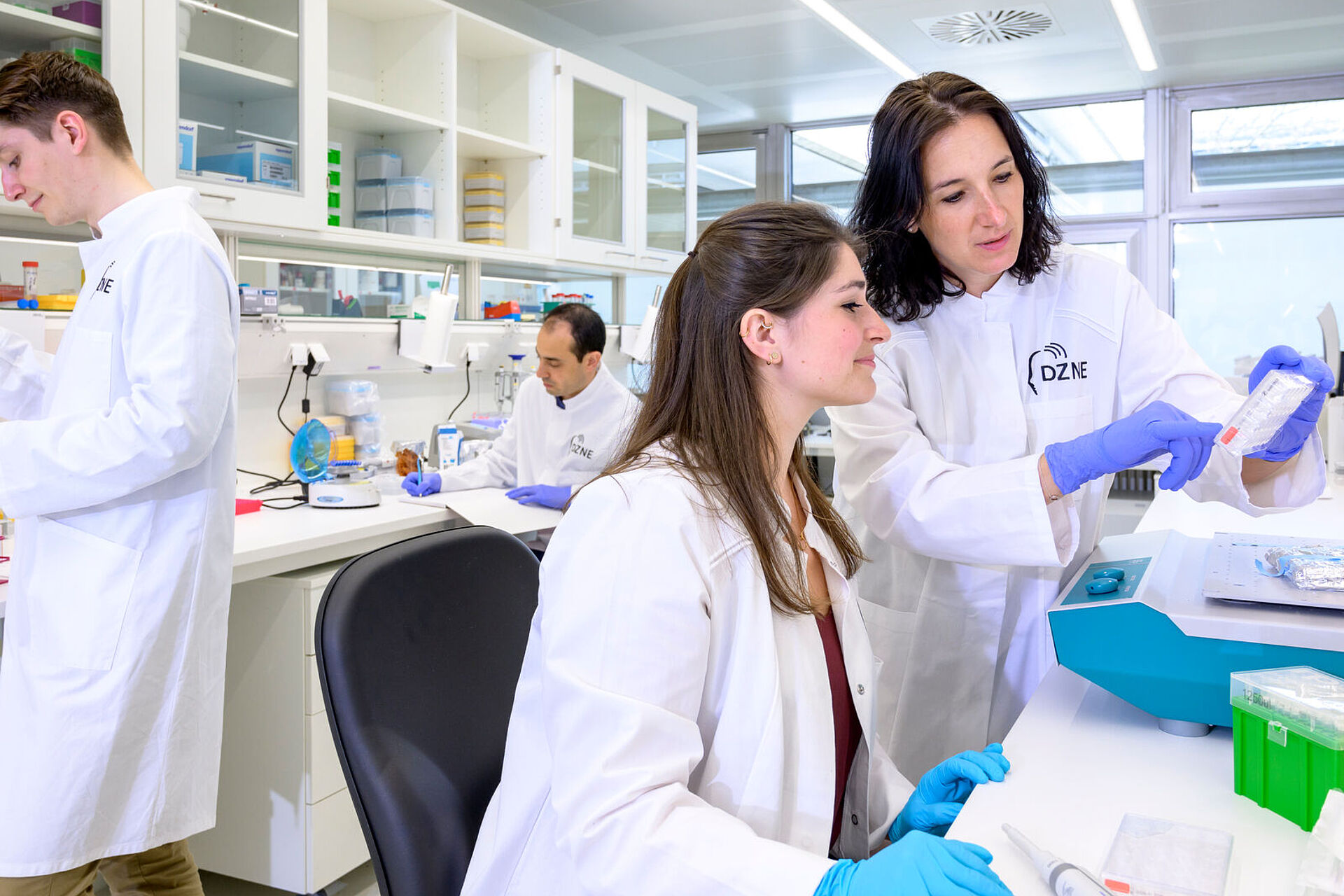 Image shows research in a large laboratory.