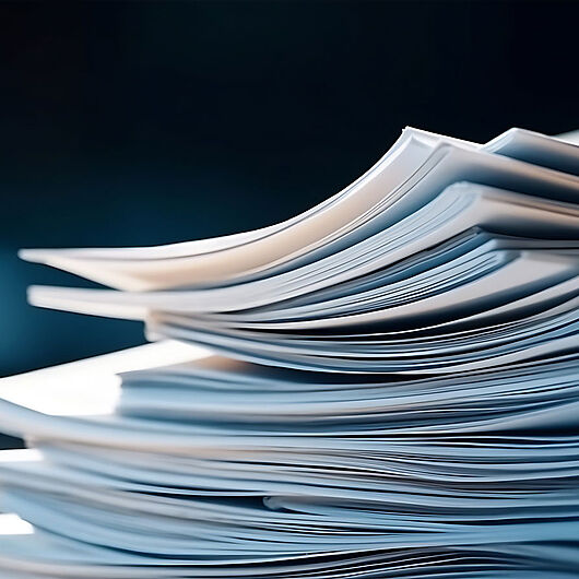 Symbolic image shows pile of paper.
